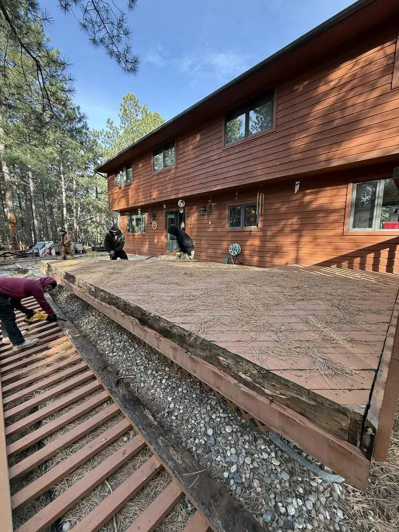 Channel drain installed along hardscape patio edge in Colorado Springs
