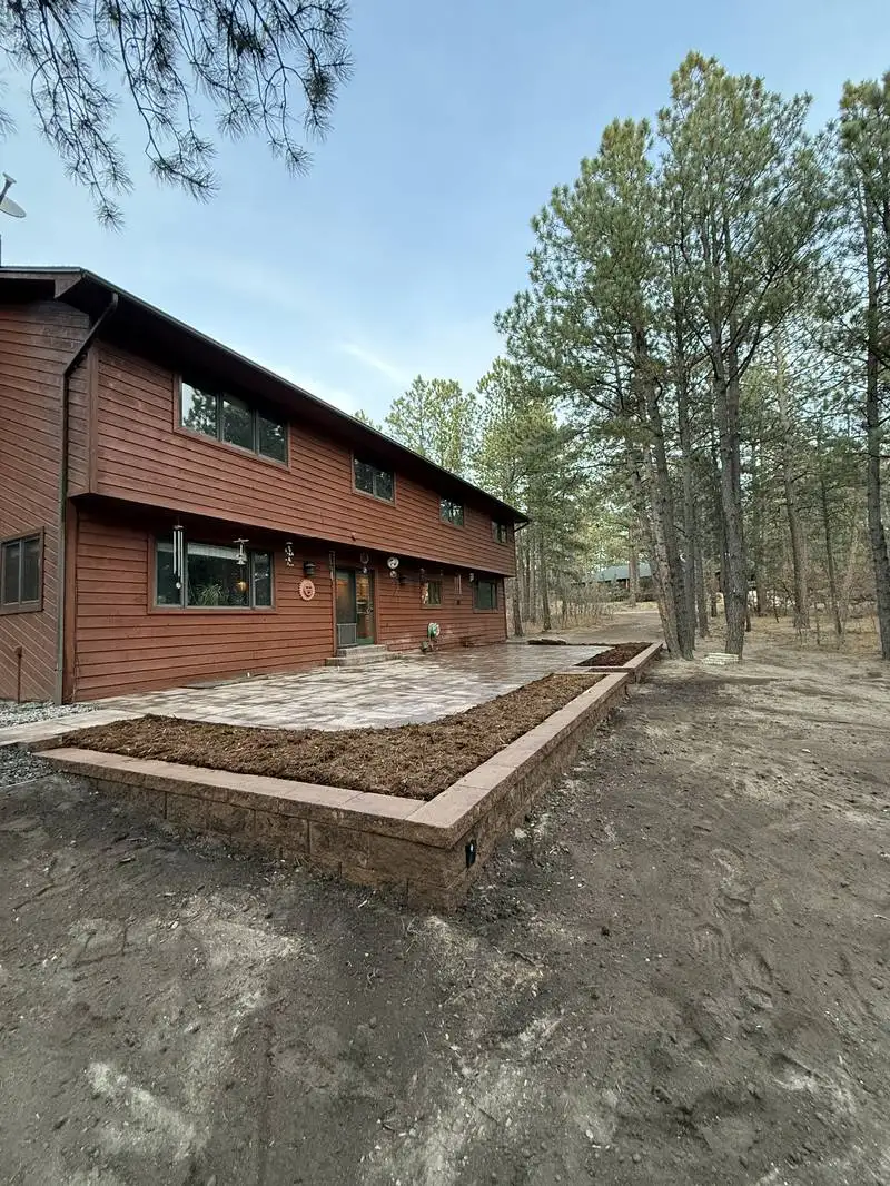 Completed hardscape project with proper drainage grading in Colorado Springs