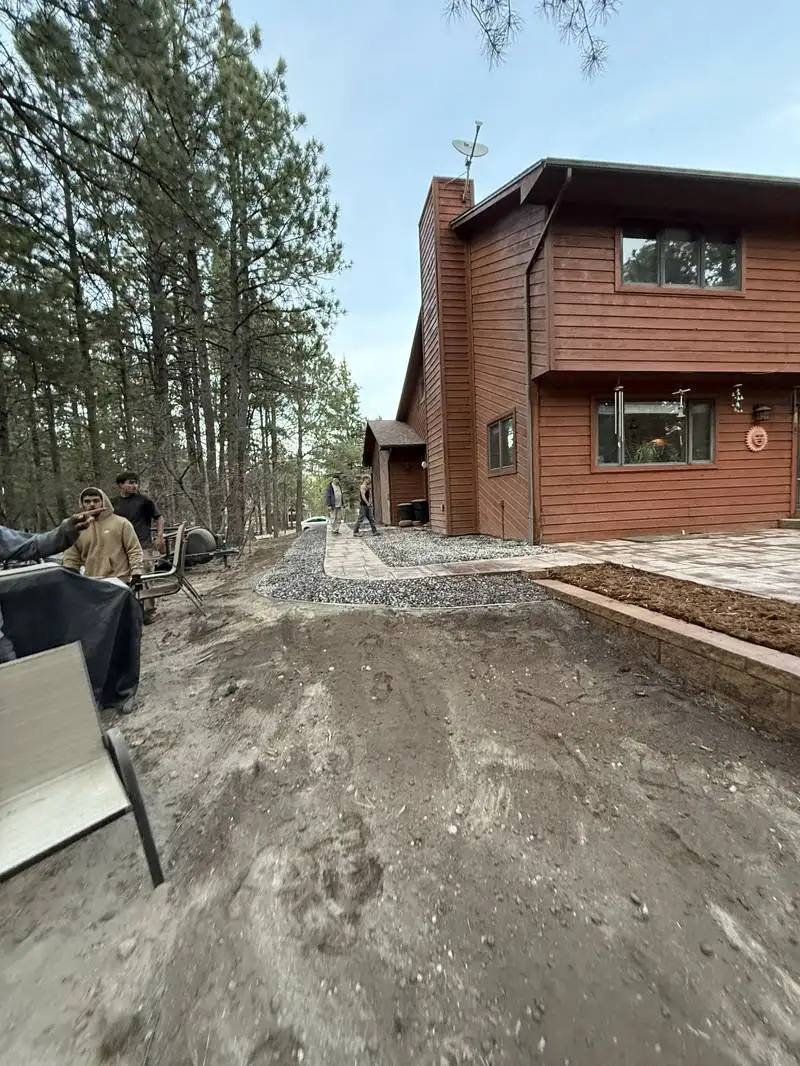 Integrated hardscape patio and landscape design in Colorado Springs pine setting
