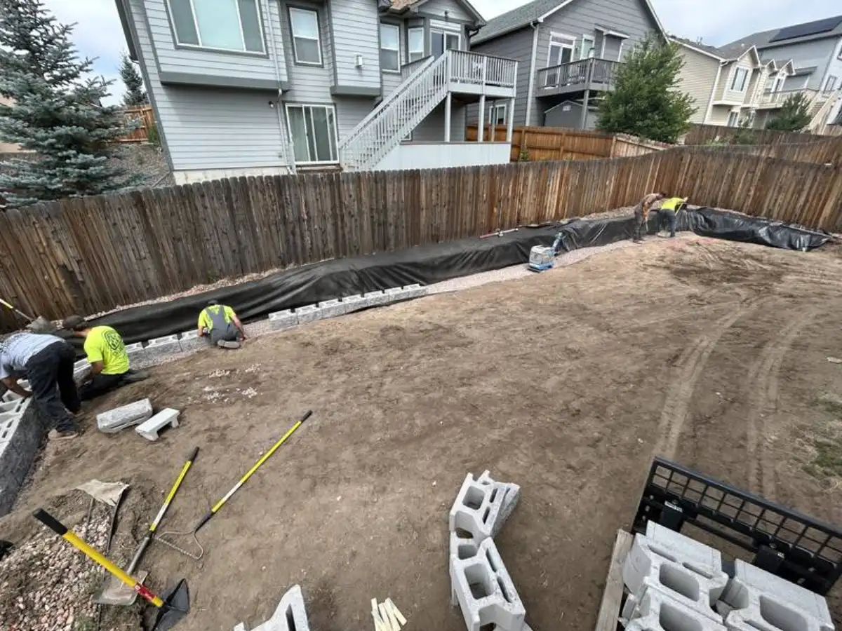 French drain trench with gravel and perforated pipe in Colorado Springs